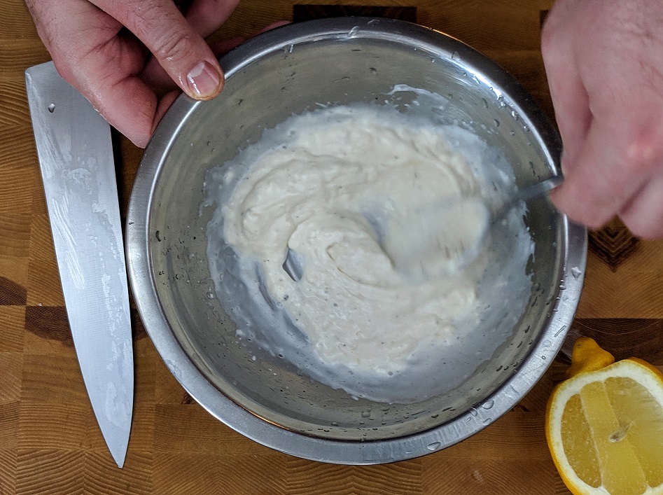 mixing garlic mayo