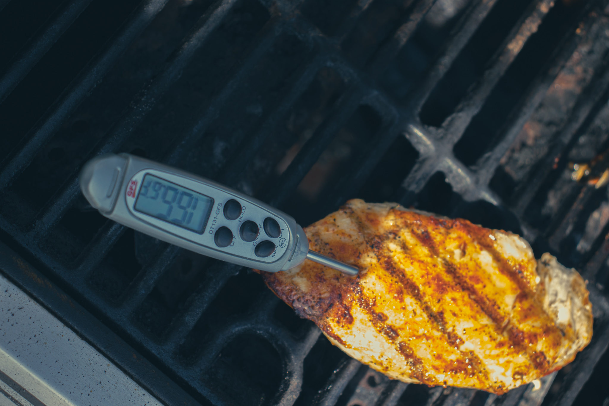 temperature check on a grilled chicken breast