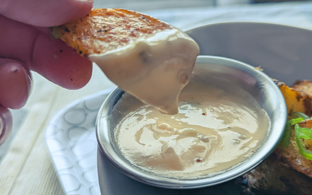 Crispy Oven-Baked Cajun Potato Wedges with Jalapeno Cheese Sauce